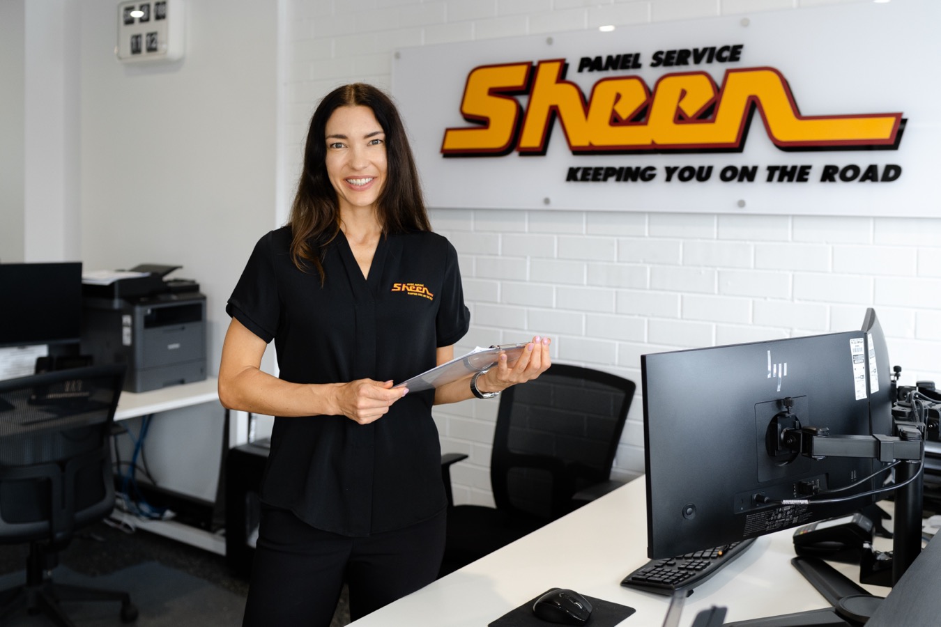 Sheen team member assisting a customer